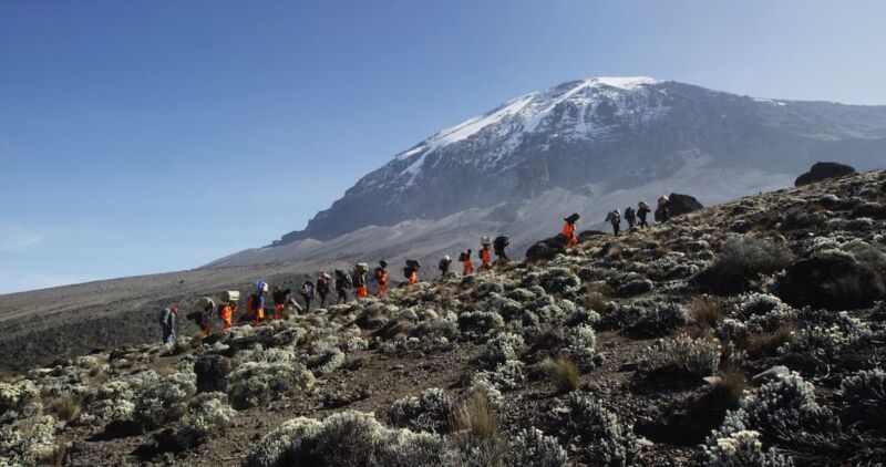 Our porters on the ridge leading to Stella Point with Kibo behind